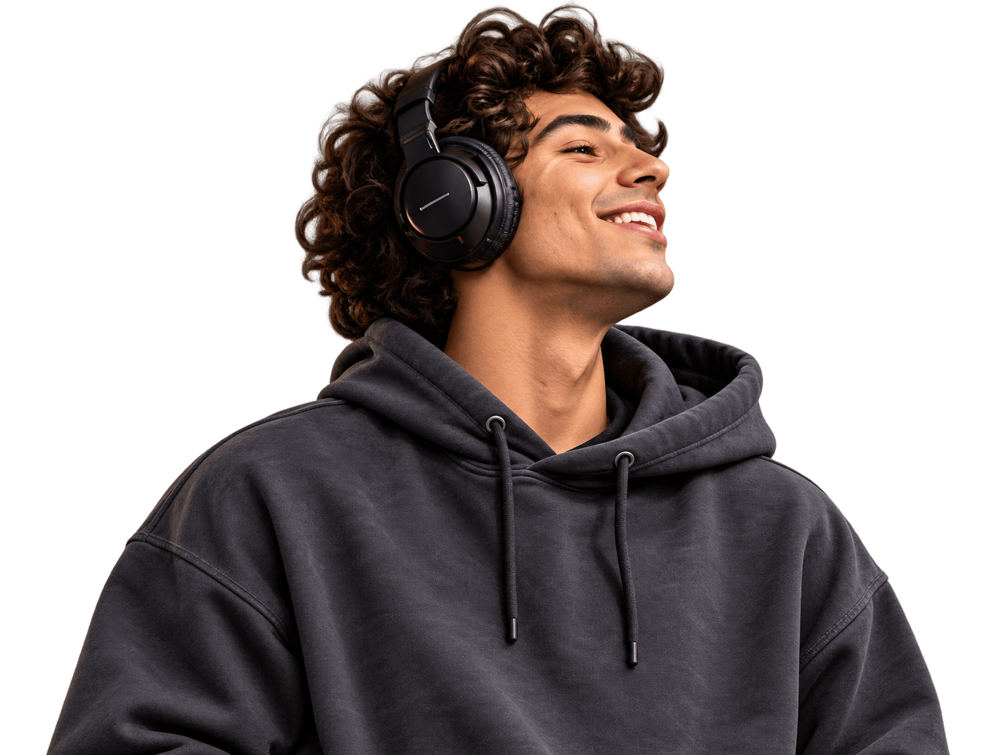 Curly-haired creative smiling toward the right, wearing black headphones and a charcoal hoodie